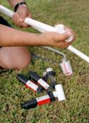  irrigation contractor in Glen Burnie MD fits PVC pipe for a zone addition